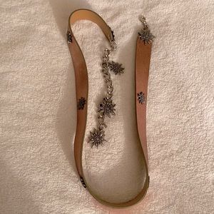 Leather belt -NWOT with metallic finish. Beautifully, uniquely decorated.